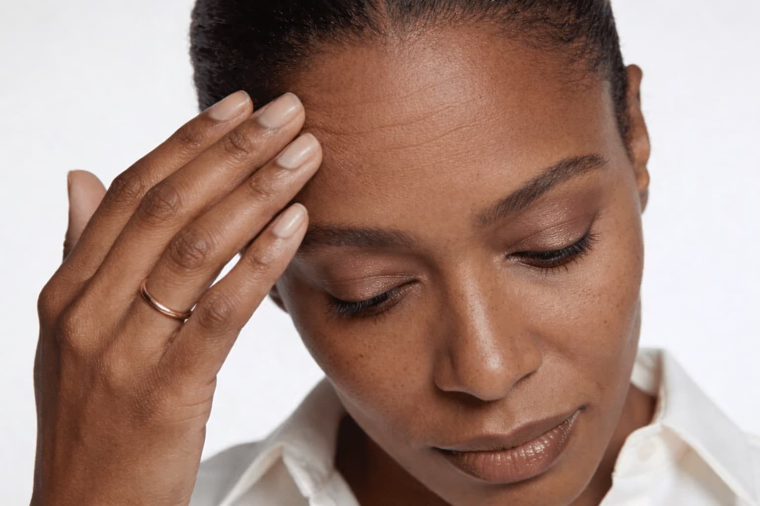 Forehead and glabella marked by expression lines.